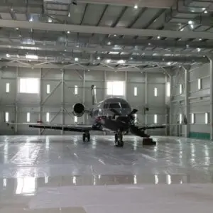 Aircraft spray booth interior with a light aircraft