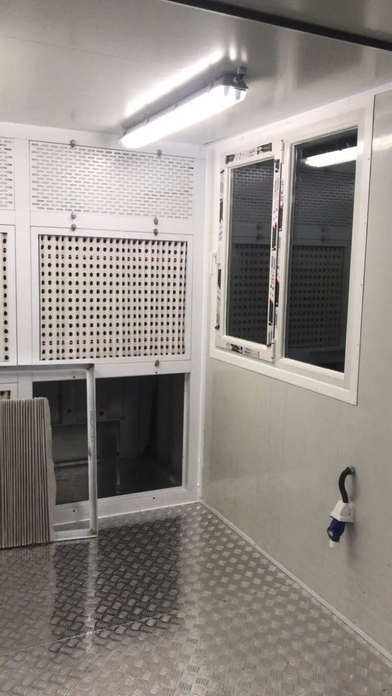 Container paint booth interior with window