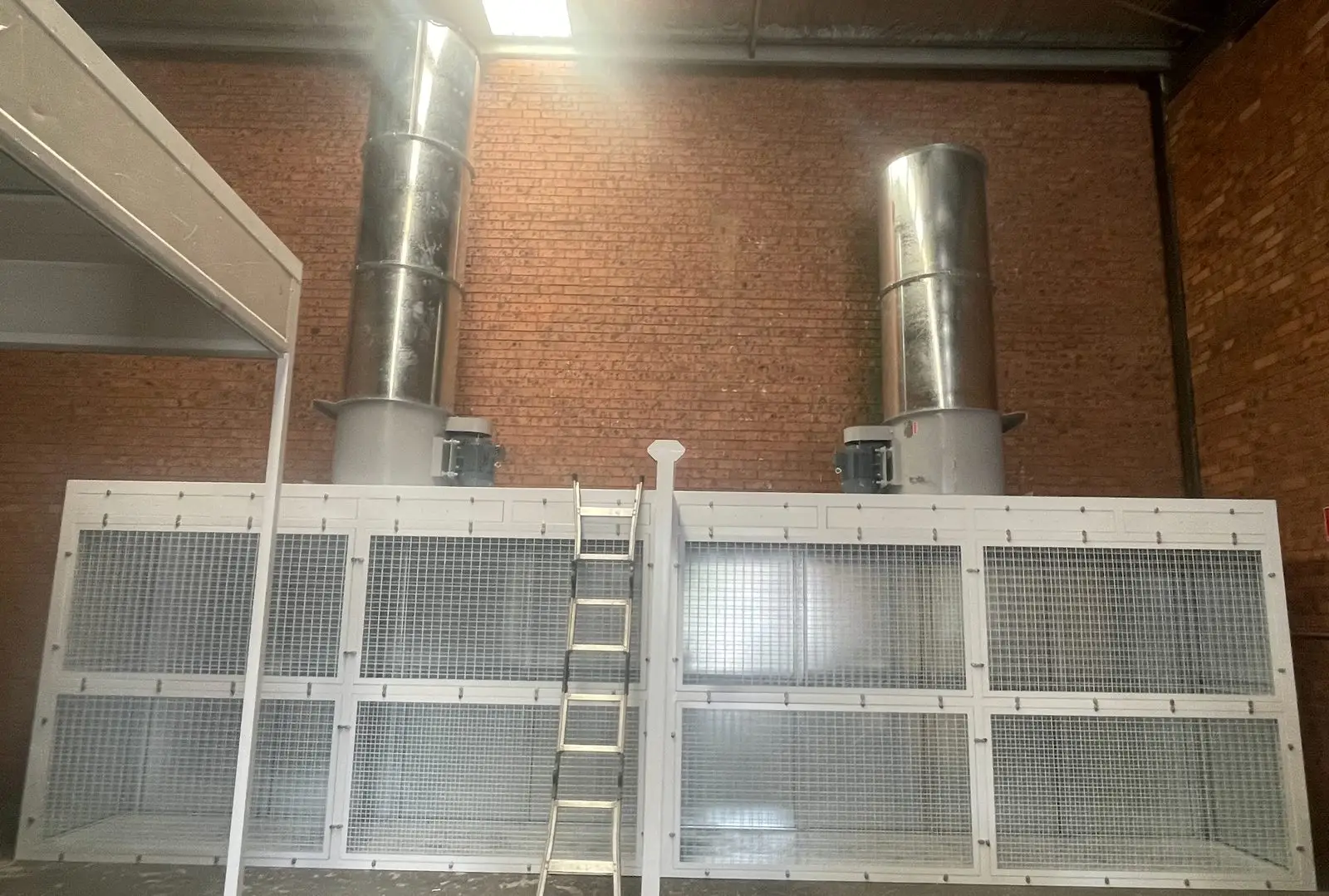 Open front paint booth with twin exhaust stacks